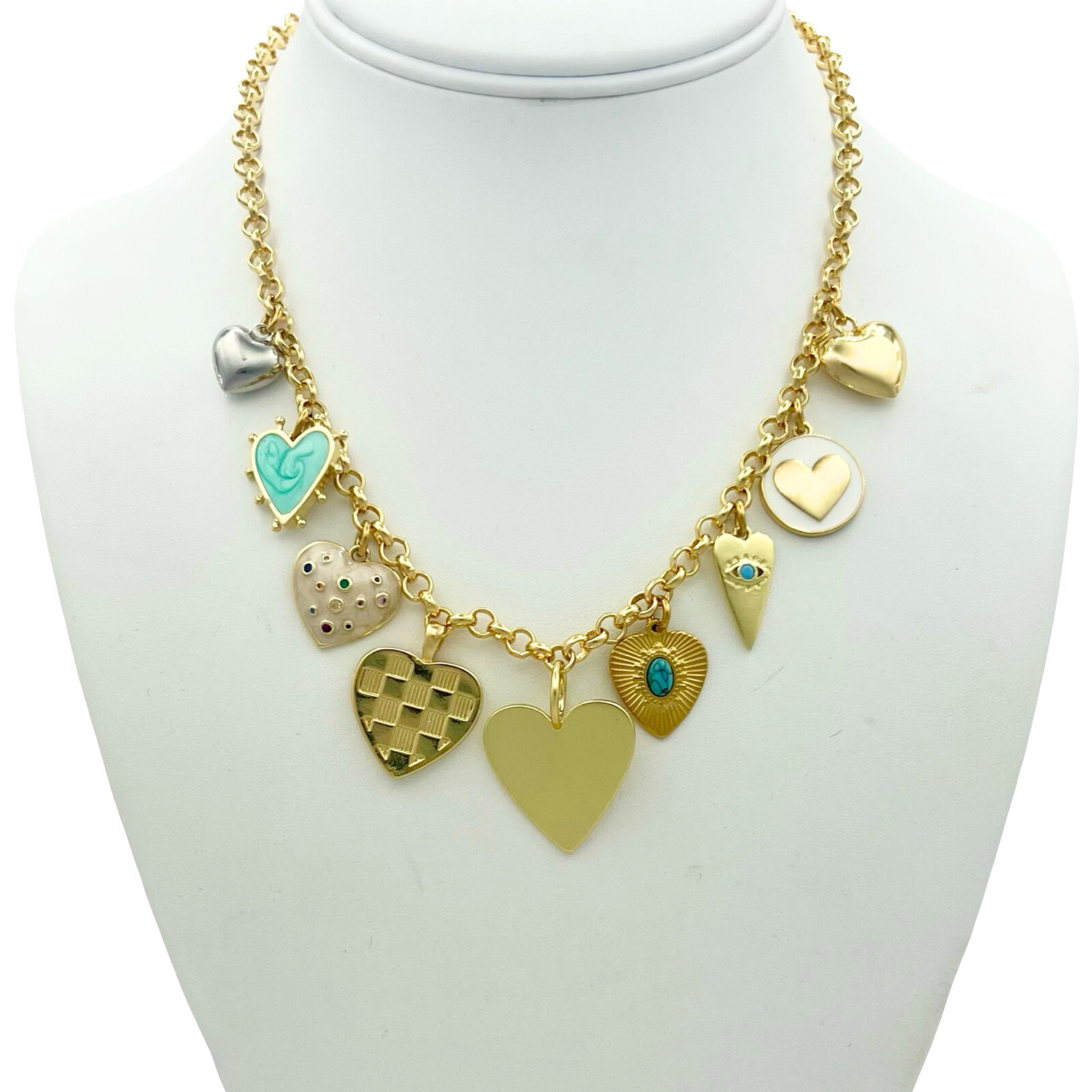 Gold rolo chain necklace with mixed heart charm pendants including enamel, evil eye, and turquoise hearts by HOLST+LEE