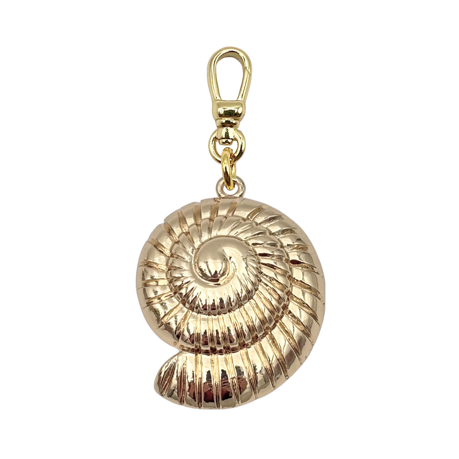 Three-dimensional gold nautilus shell charm with ridged spiral detail, with a gold charm clip by HOLST+LEE