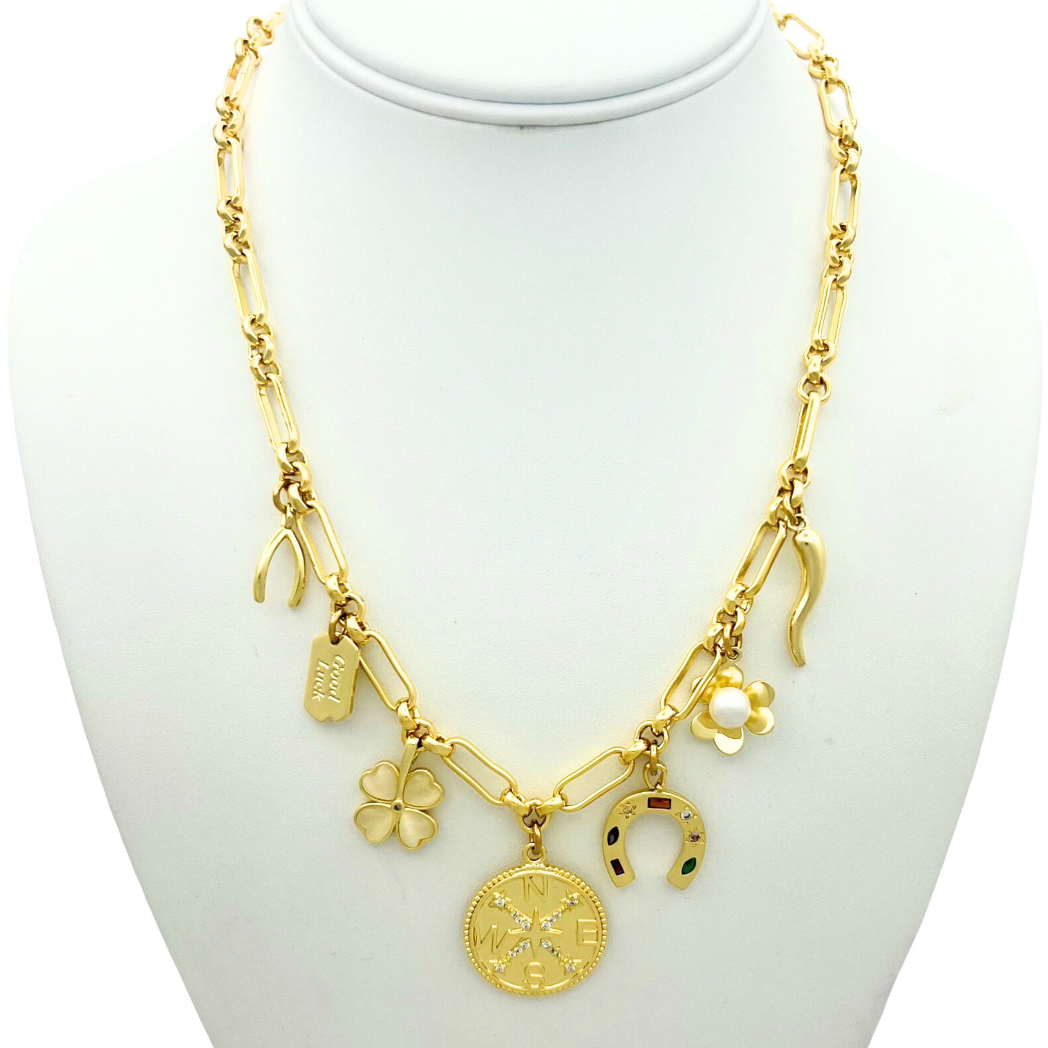 Gold thick link chain necklace with lucky charm pendants including horseshoe, wishbone, four leaf clover, and flower by HOLST+LEE