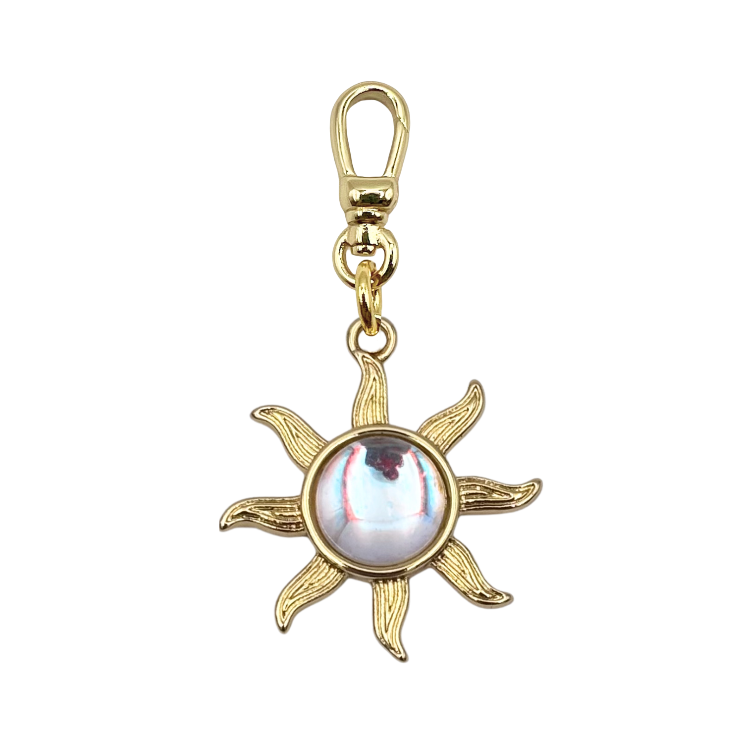 Opal sun charm with engraved gold rays and iridescent opal center stone on gold charm clip by HOLST+LEE