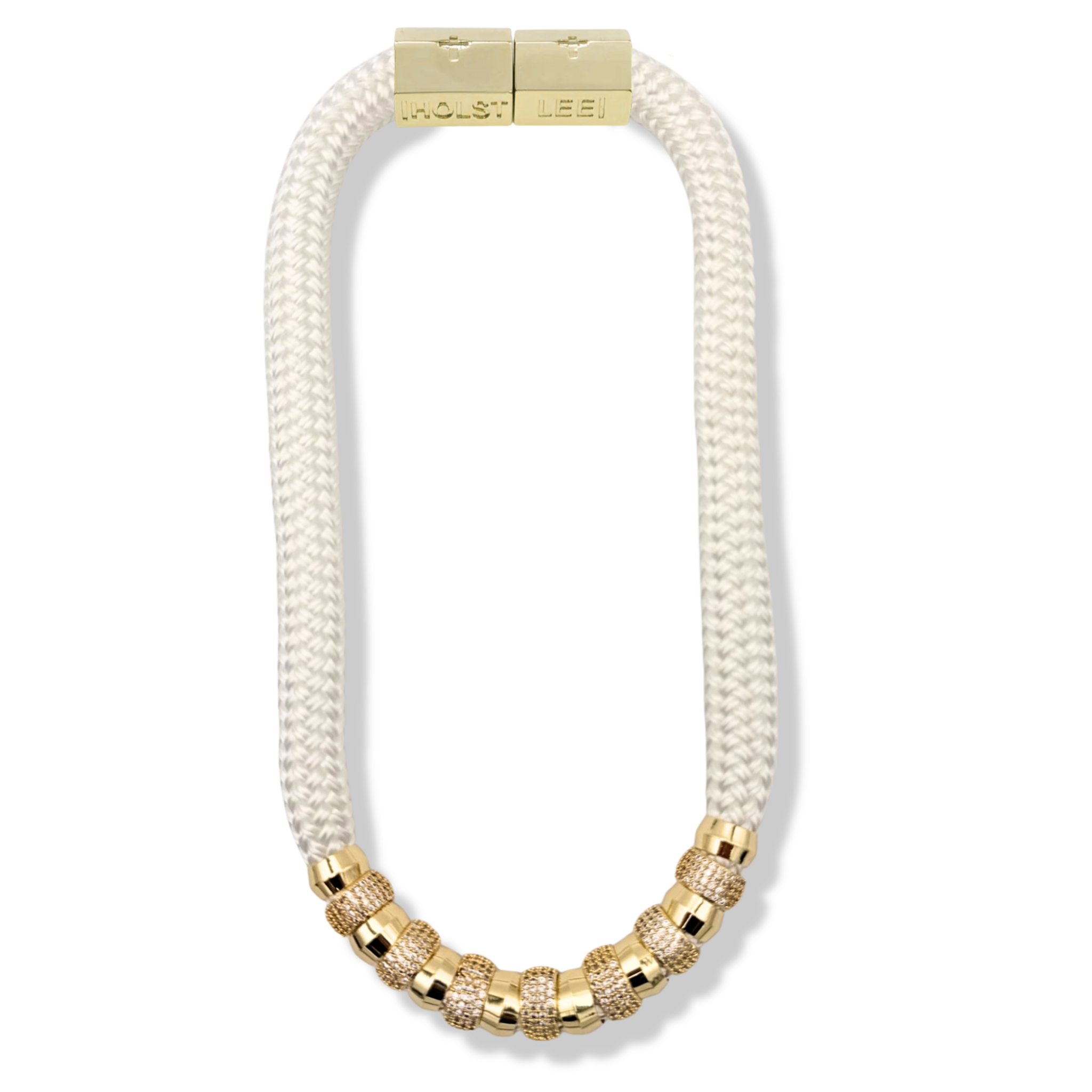 White braided rope necklace with pavé crystal and gold ferrule stack and gold magnetic clasped necklace by HOLST+LEE