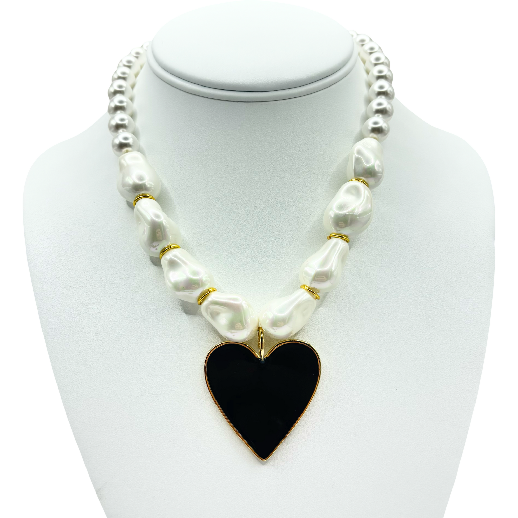 Faux pearl necklace with a black heart pendant and gold accents by HOLST+LEE