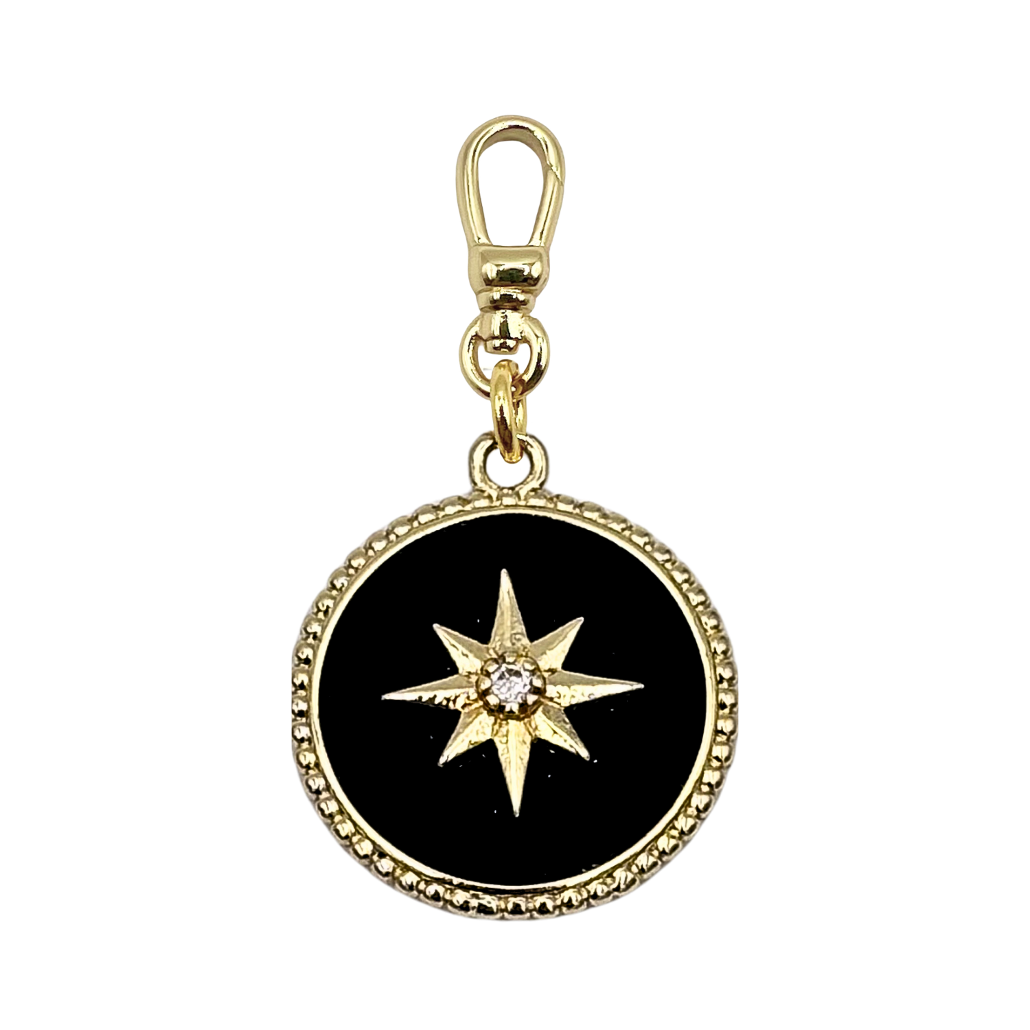 Round black enamel charm with a gold eight-pointed sunburst star and center diamond, set in a gold bezel with gold charm clip by HOLST+LEE