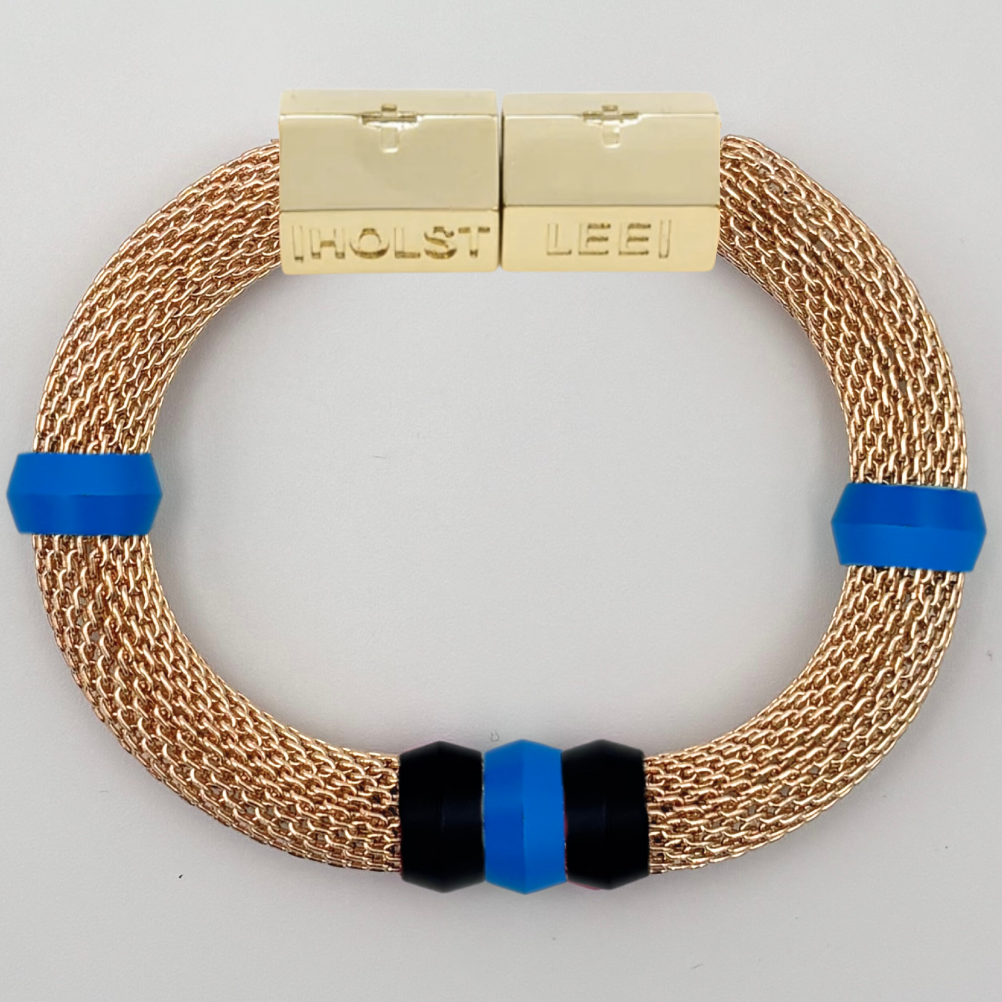 Gold woven mesh bracelet with blue and black candy ferrule accents and gold magnetic clasped bracelet by HOLST+LEE