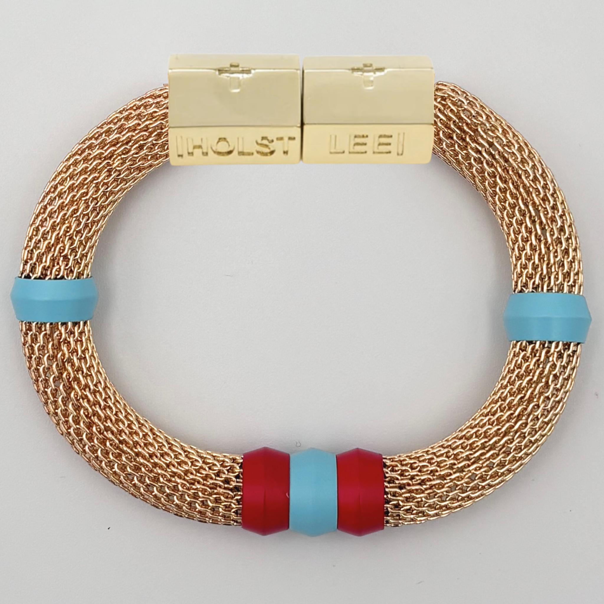 Gold woven mesh bracelet with blue and red candy ferrule accents and gold magnetic clasped bracelet by HOLST+LEE
