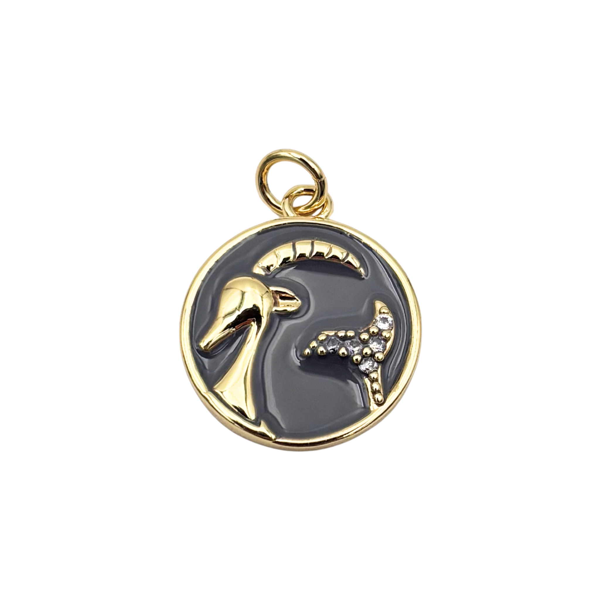 Capricorn zodiac charm pendant with dark gray enamel disc, gold sea goat symbol, and crystal accent details by HOLST+LEE