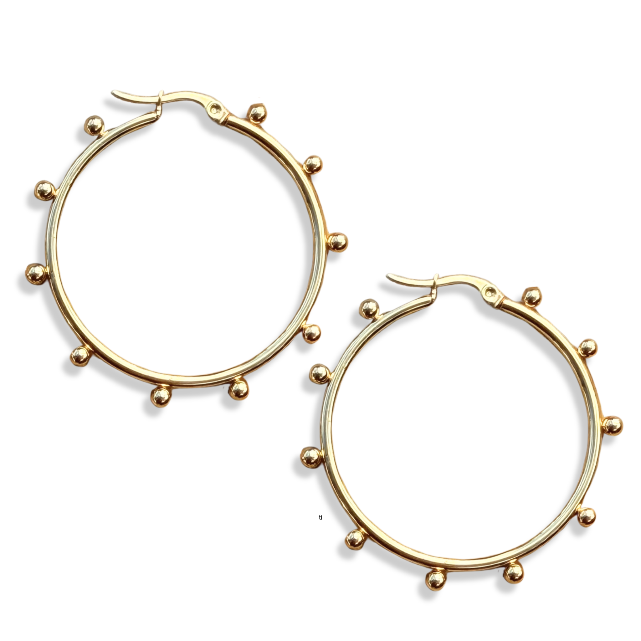 Gold hoop earrings with small balled accents by HOLST+LEE