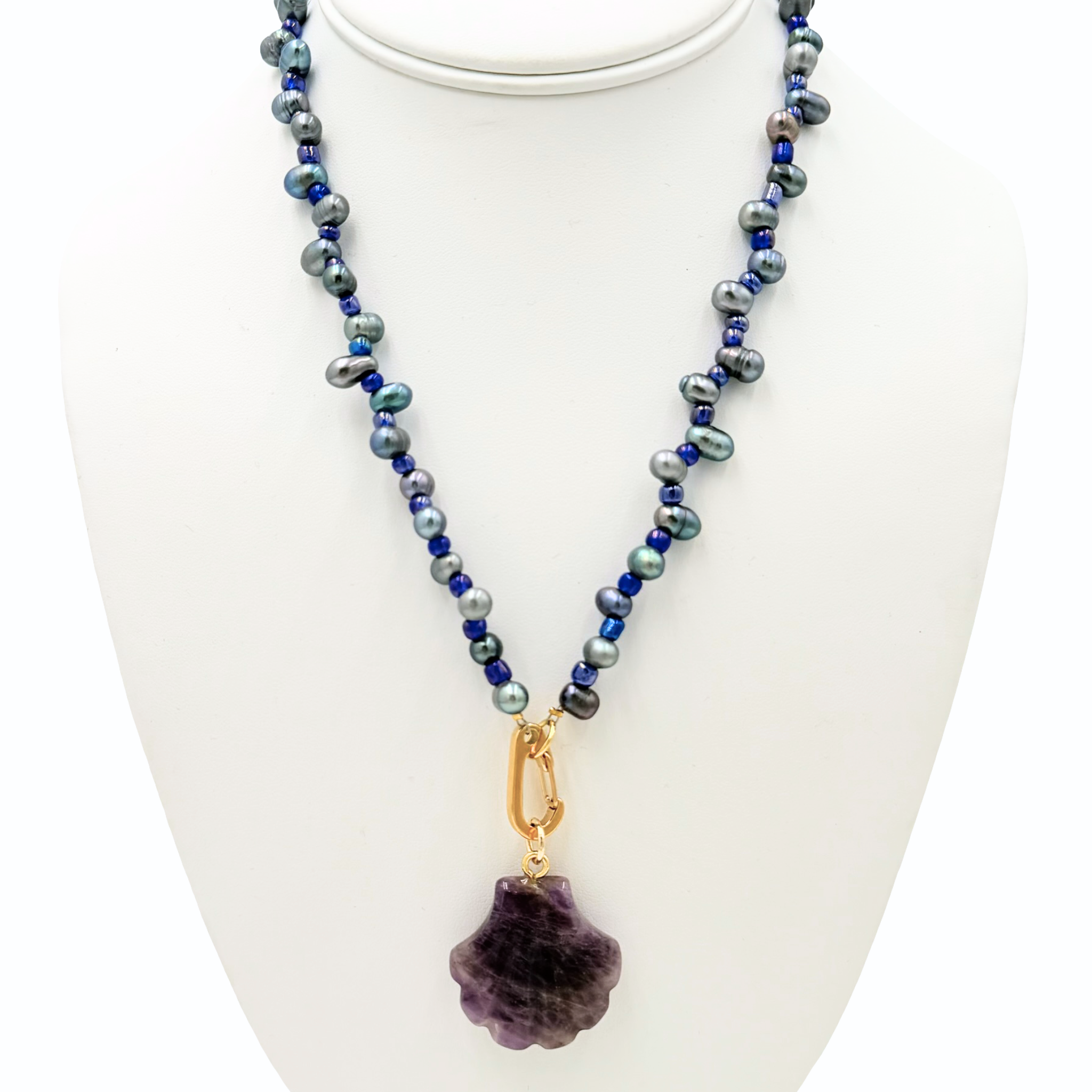 Freshwater pearl necklace with small bead embellishments featuring a semi-precious shell pendant by HOLST+LEE