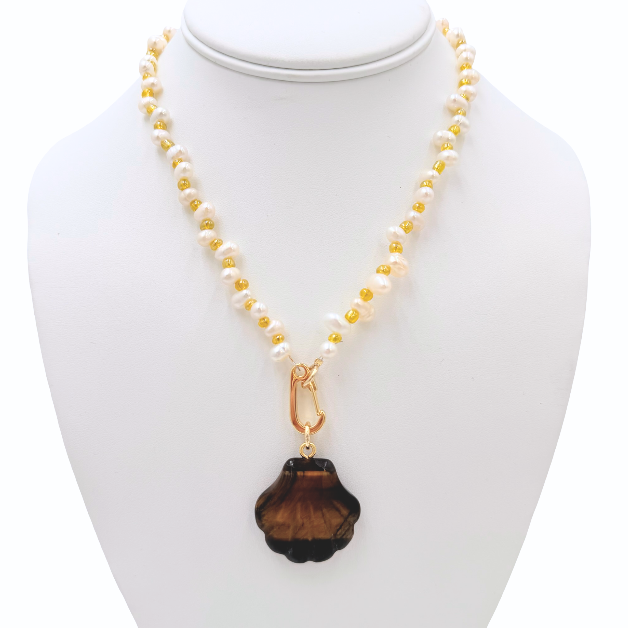 Freshwater pearl necklace with small bead embellishments featuring a semi-precious shell pendant by HOLST+LEE