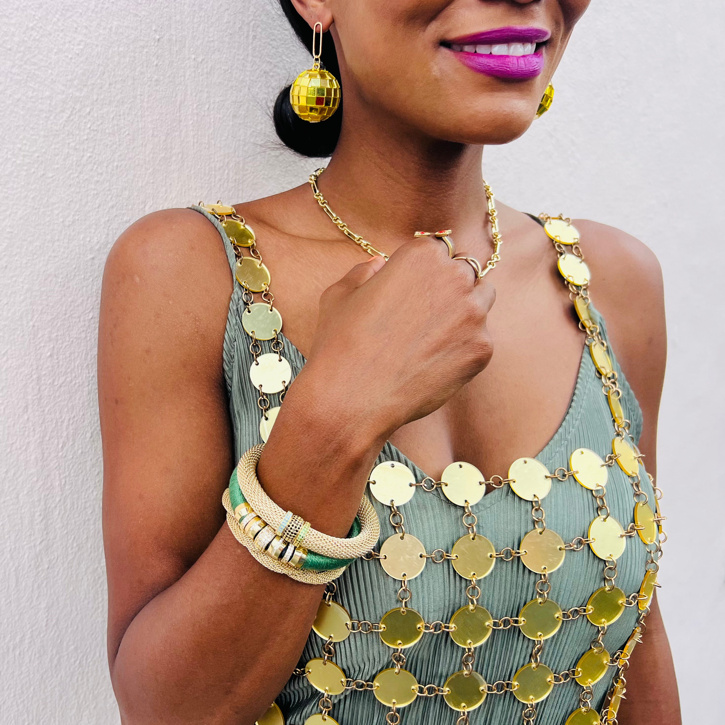 Gold Disco Ball Earrings on model 