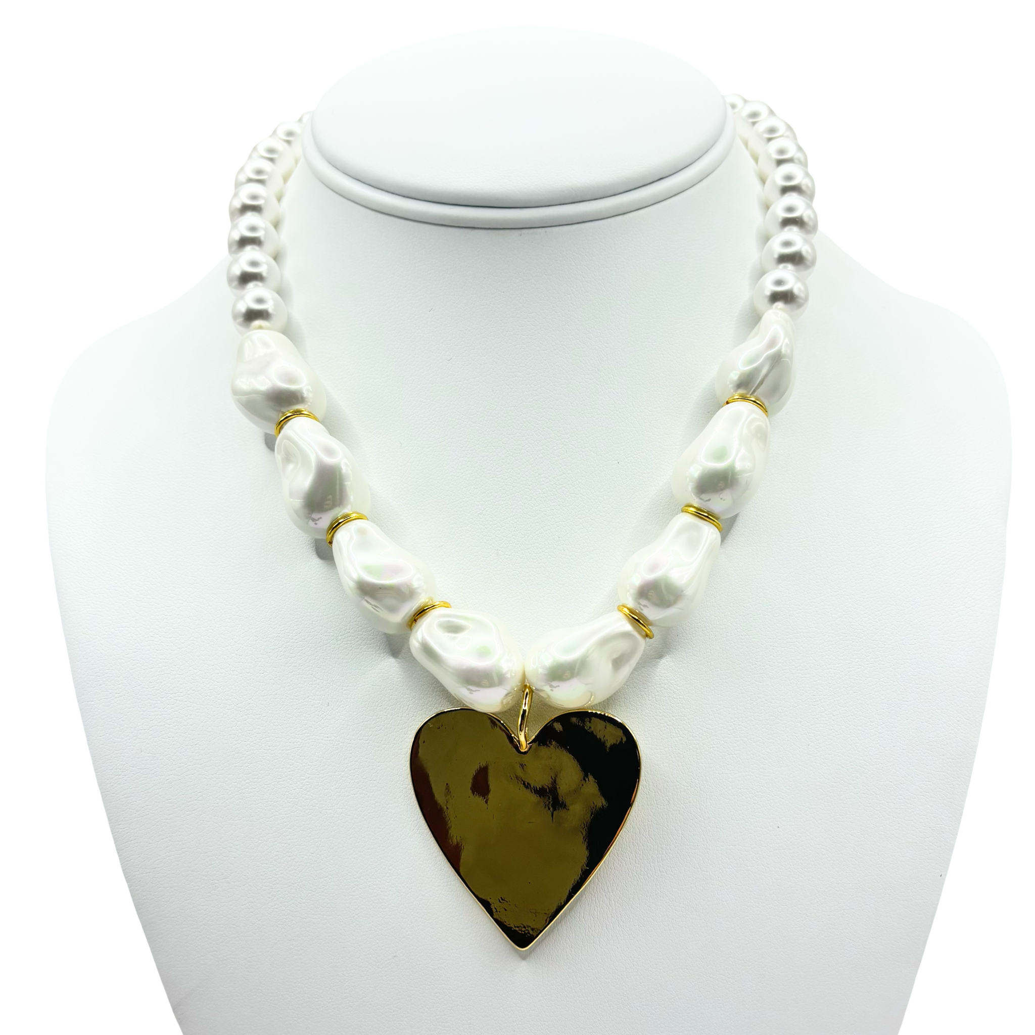 Faux pearl necklace with a gold heart pendant with gold accents by HOLST+LEE