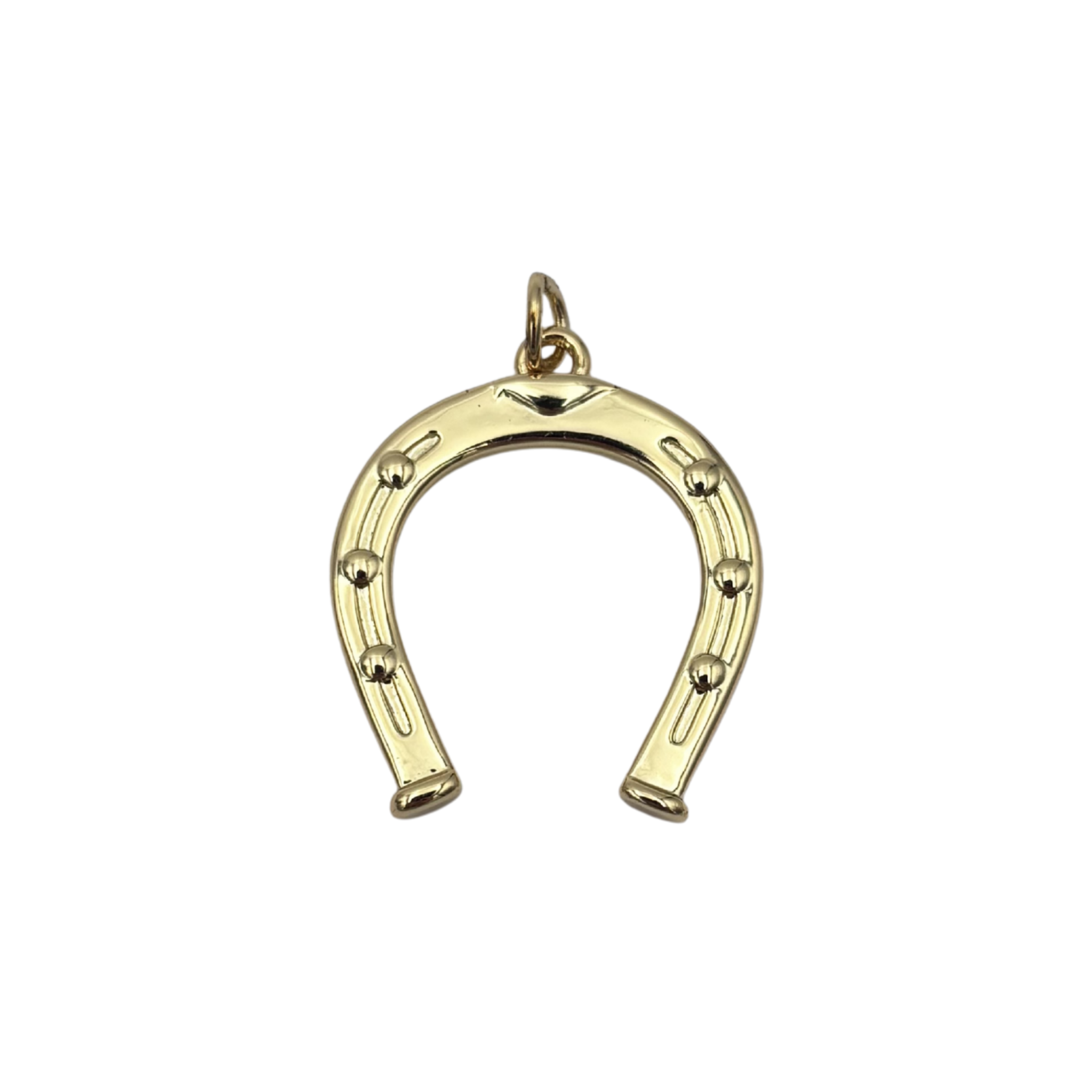 Gold horseshoe charm with engraved nail holes and raised stud detail by HOLST LEE