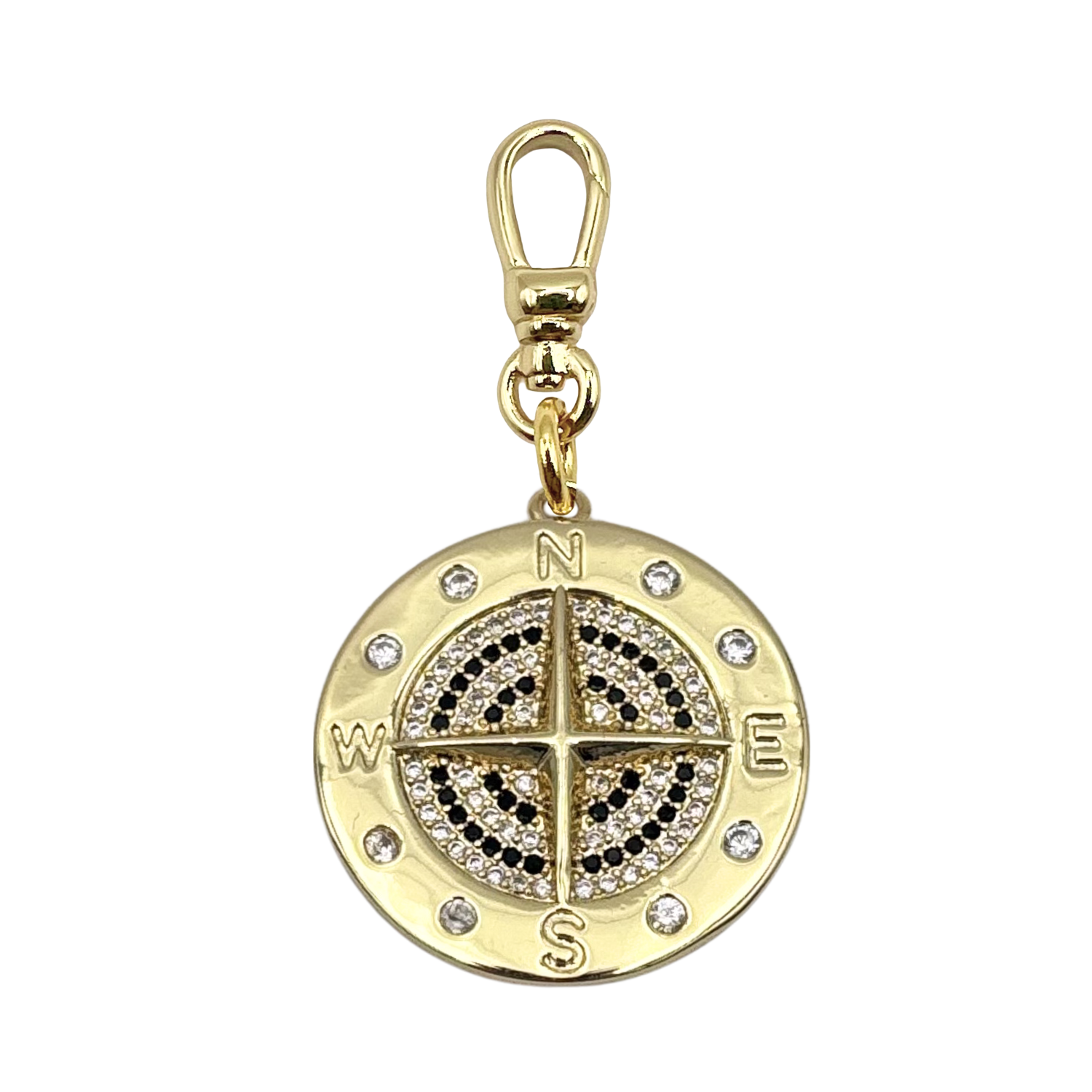 Gold compass charm with pavé black and white diamonds, cardinal directions, and gold charm clip by HOLST+LEE