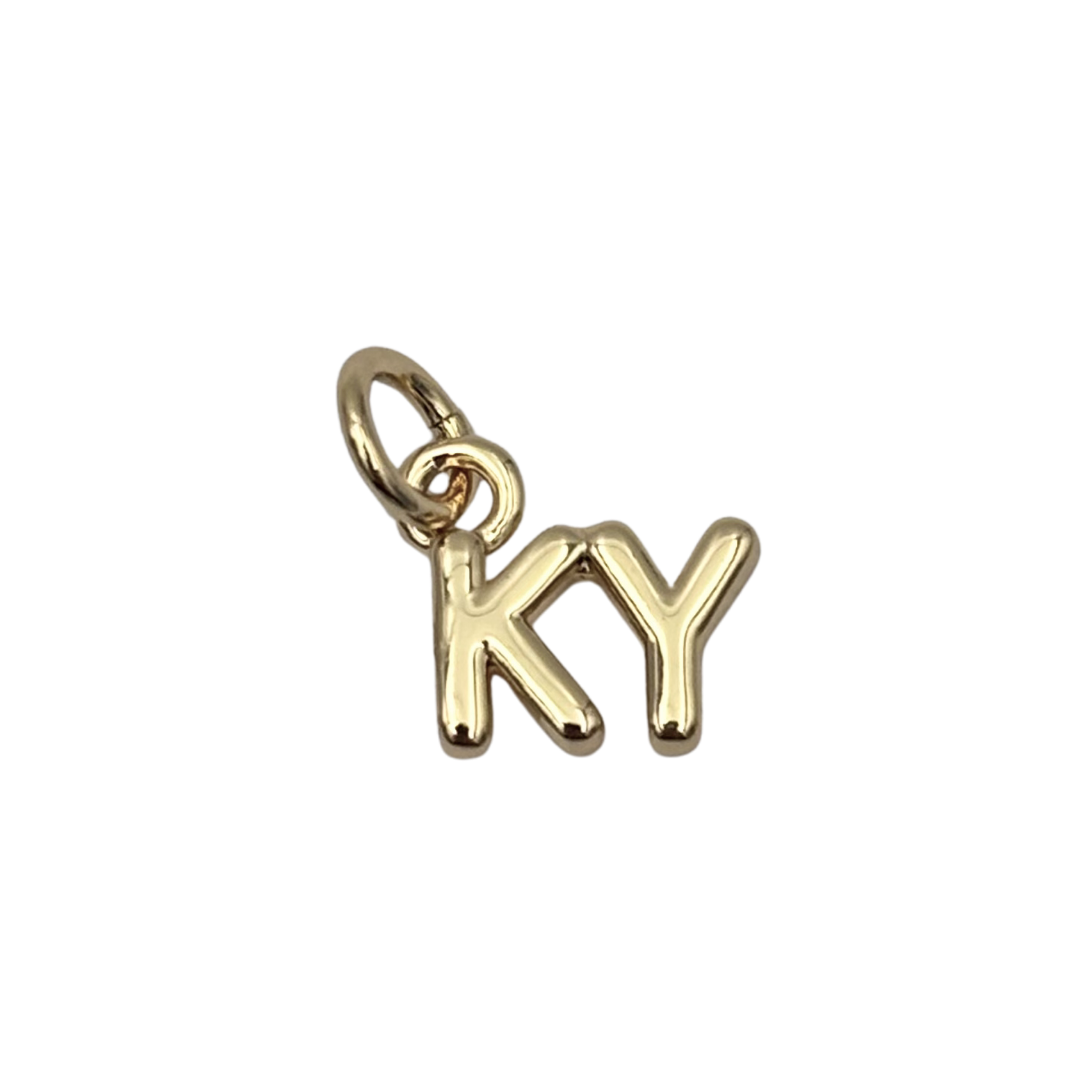 Gold 'KY' charm with sleek finish by HOLST+LEE