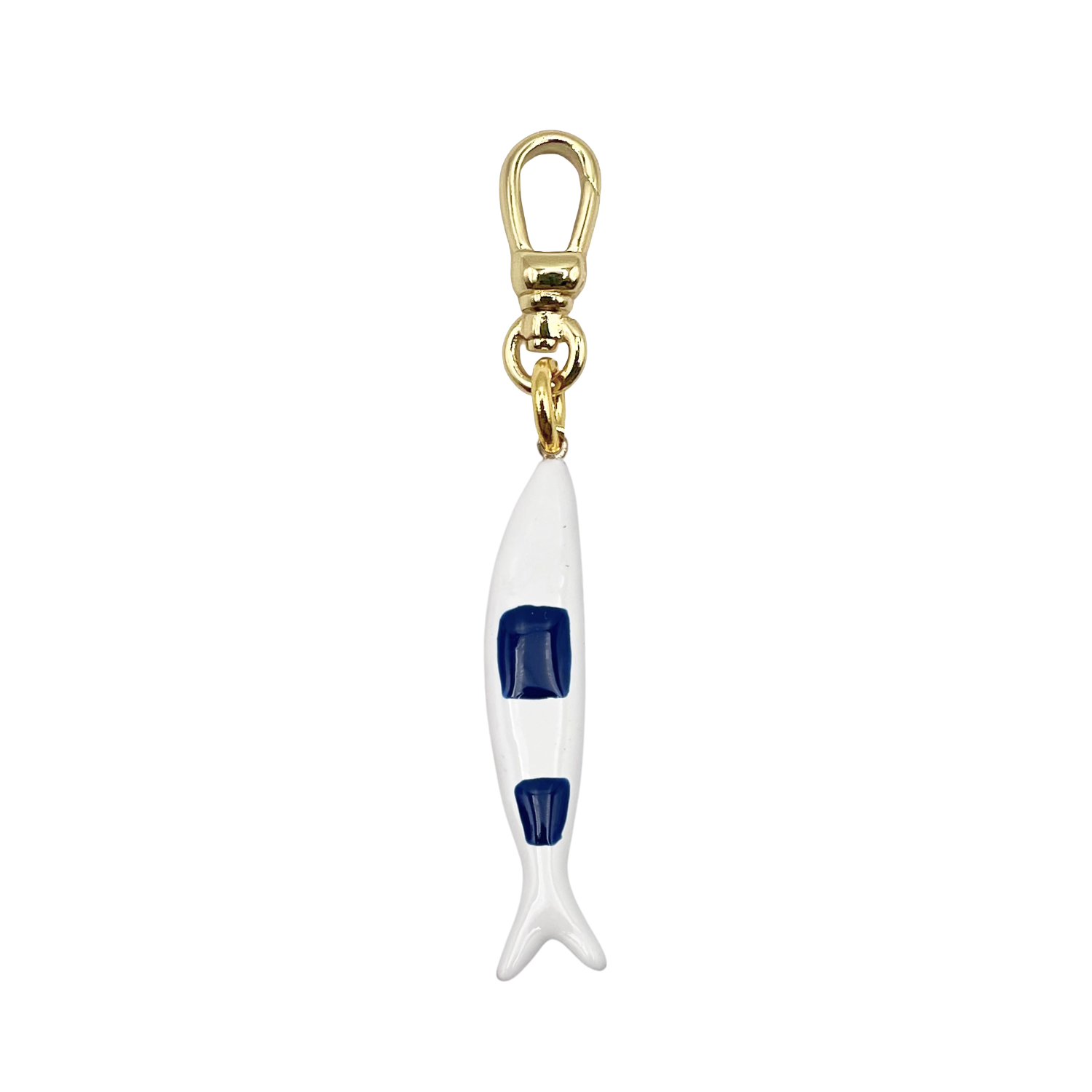 Slim white enamel fish charm with navy blue body stripe with gold charm clip by HOLST+LEE