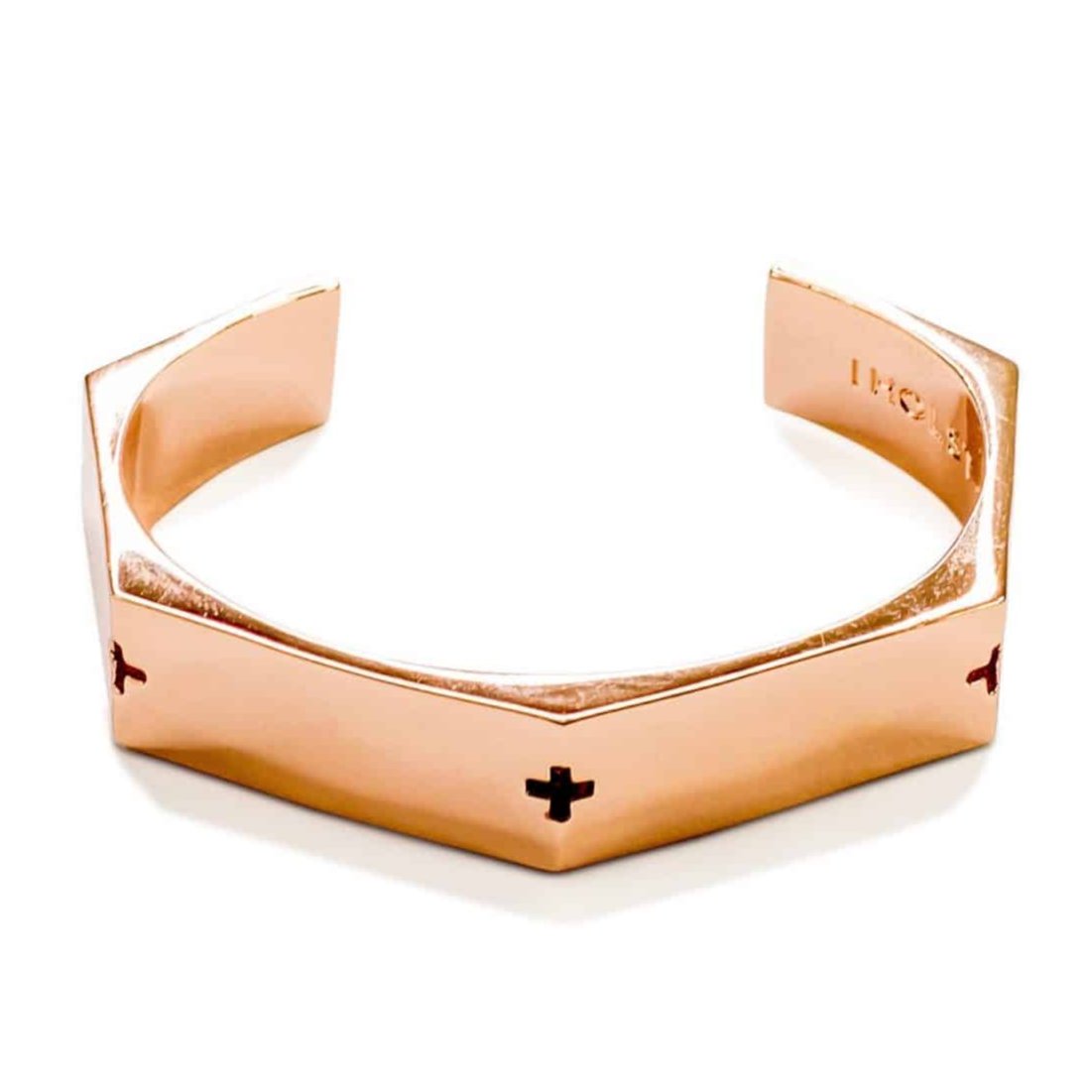 Rose gold metal cuff bracelet with small engraved crosses on the sides by HOLST+LEE