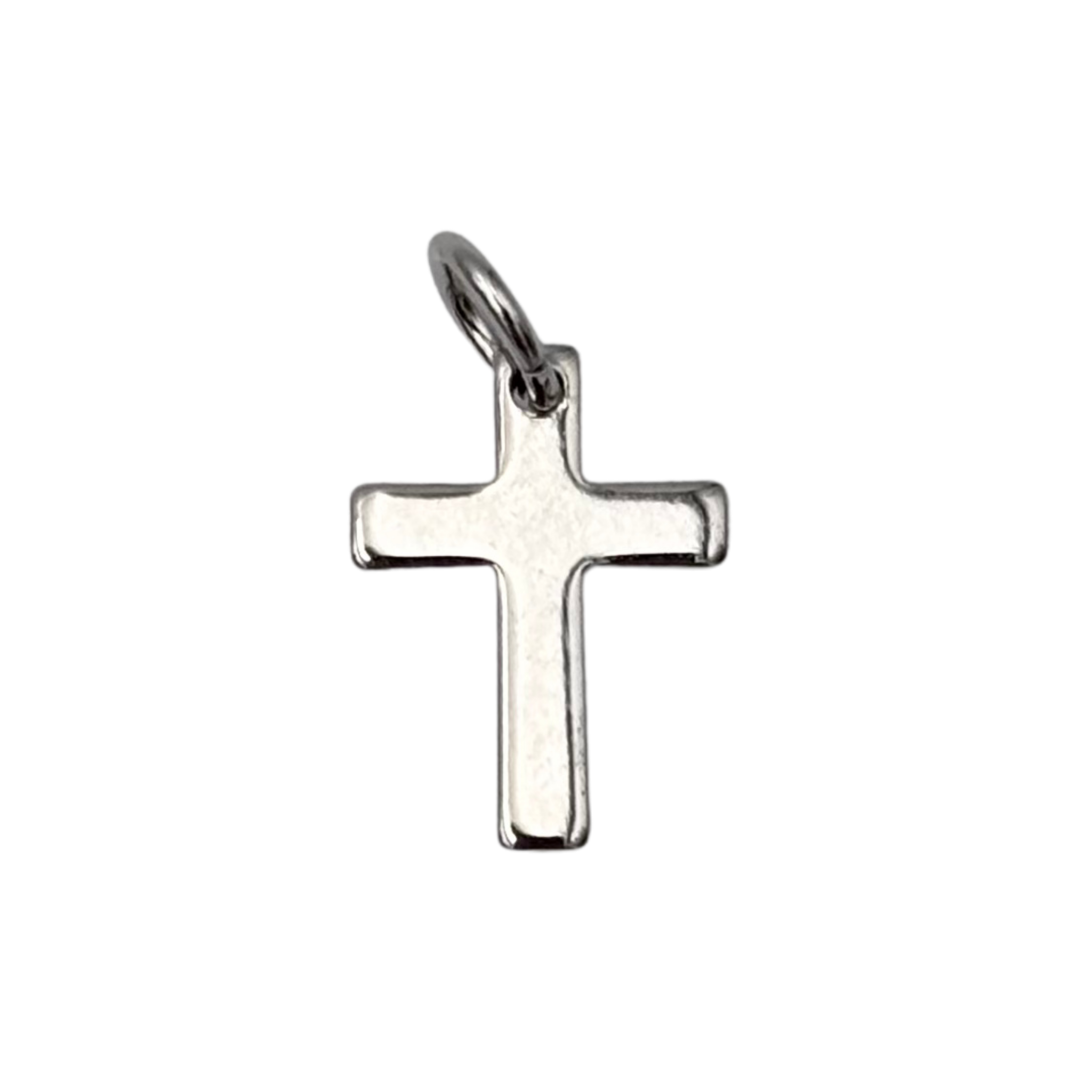 Simple silver cross charm with sleek finish by HOLST+LEE
