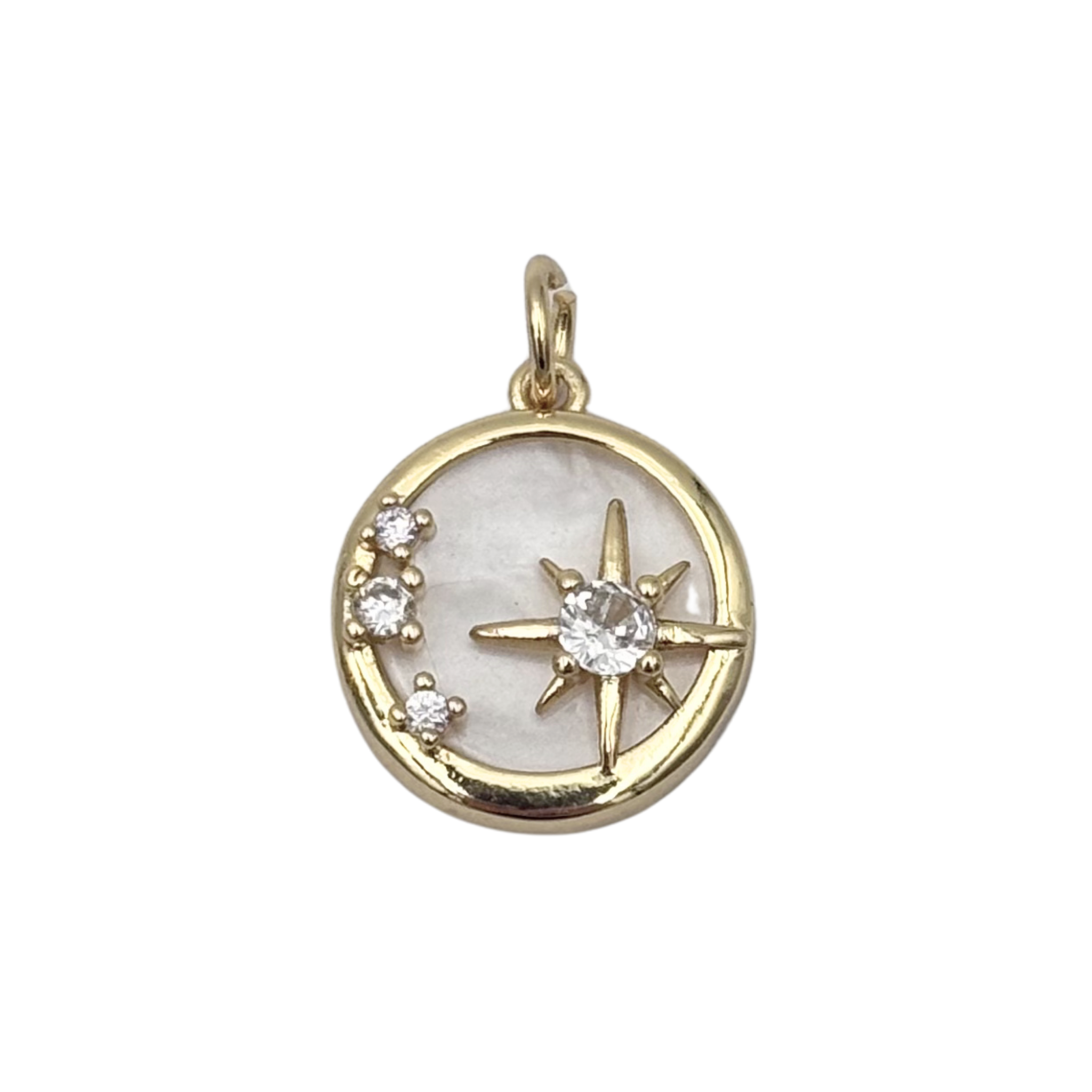 Gold round medallion charm with mother-of-pearl face, eight-point star with crystal center, and crescent crystal cluster by HOLST+LEE