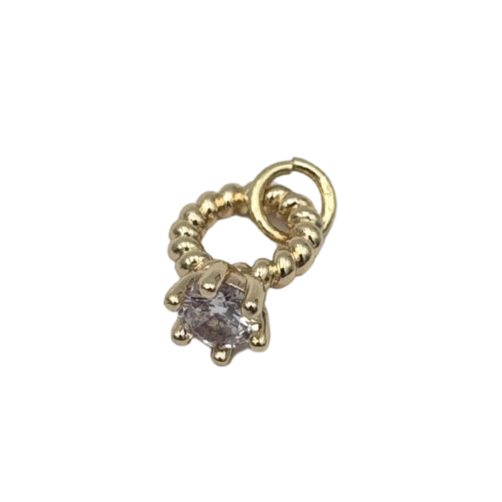 Gold twisted wedding ring with a clear gemstone by HOLST+LEE