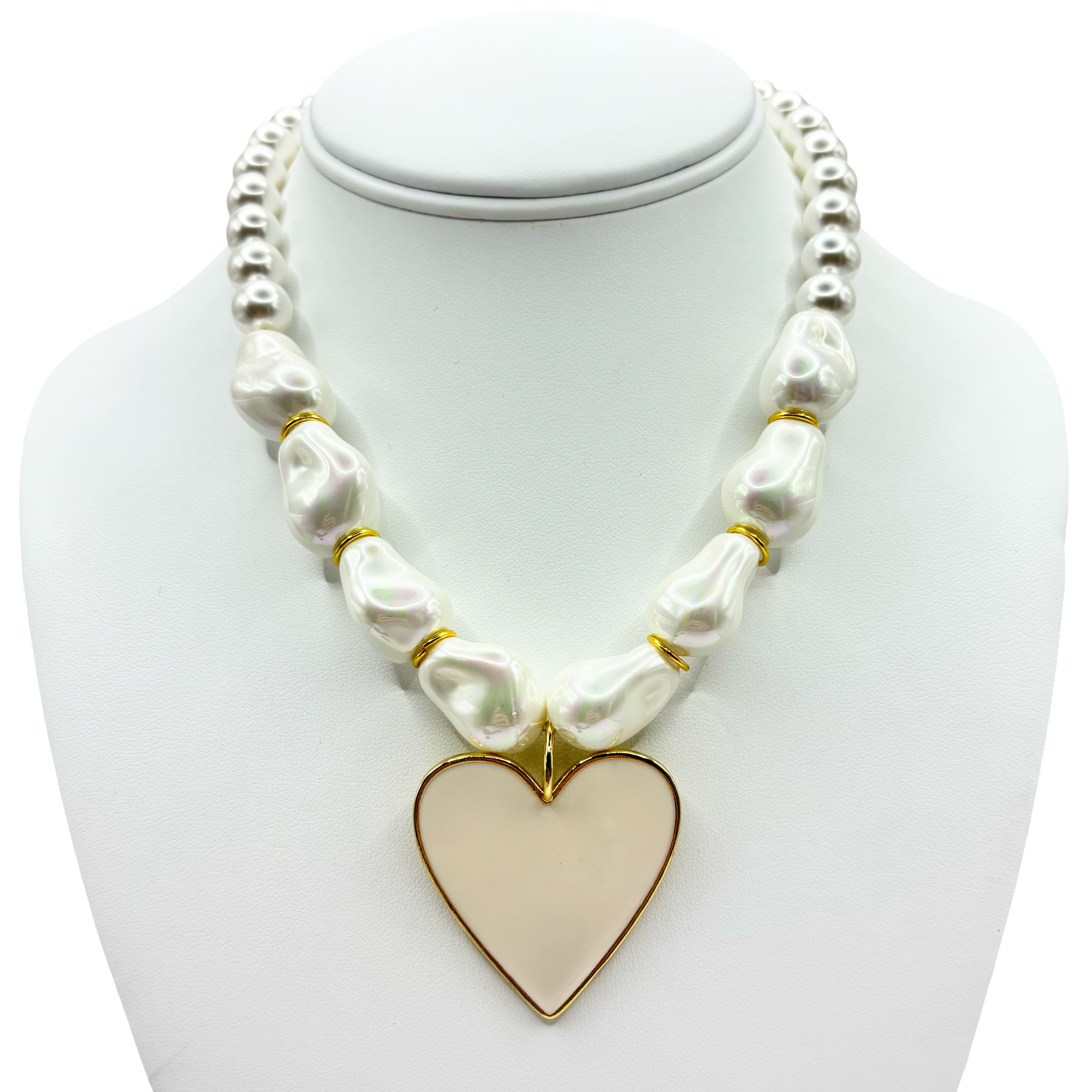Faux pearl necklace with a gold heart pendant with gold accents by HOLST+LEE